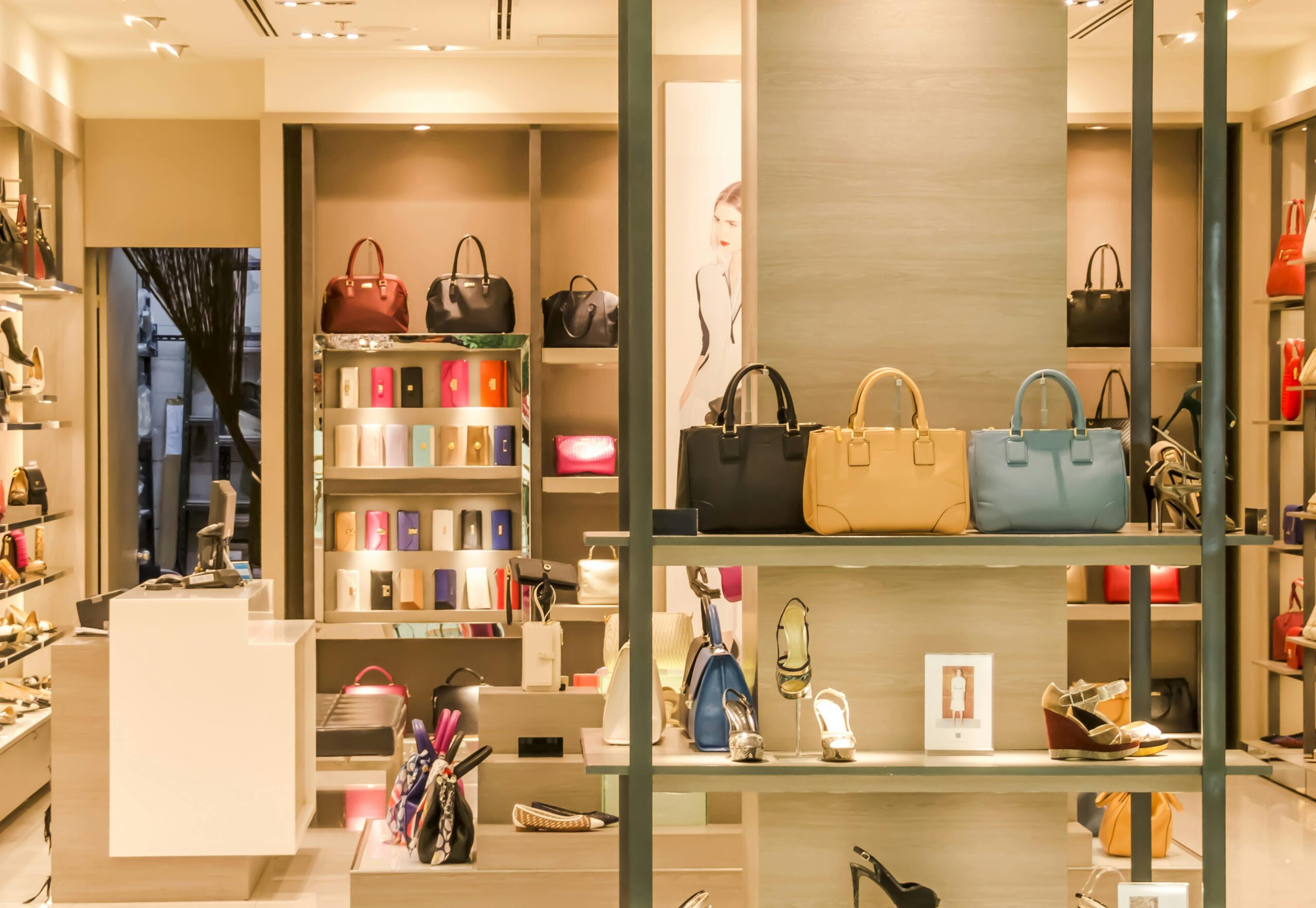 Home Chic boutique with a variety of handbags and shoes elegantly displayed on shelves.